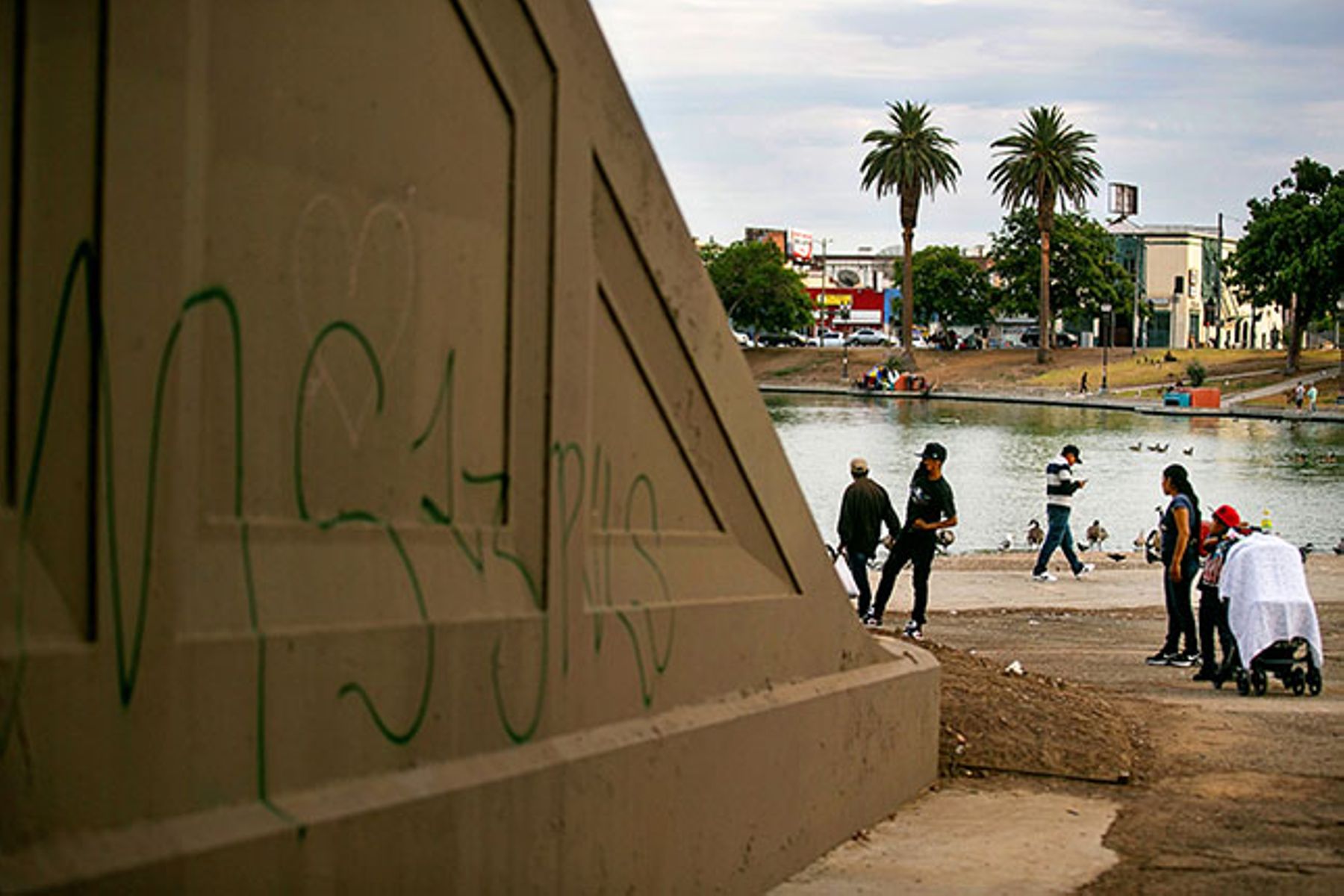 Gang-related graffiti mark territory in L.A.’s MacArthur Park. In 2020, LAPD Chief Michel Moore banned his officers from accessing a statewide gang database, impeding their ability to locate gang associates of shooting and homicide suspects. (JASON ARMOND/LOS ANGELES TIMES/GETTY IMAGES) Gang-related graffiti mark territory in L.A.’s MacArthur Park. In 2020, LAPD Chief Michel Moore banned his officers from accessing a statewide gang database, impeding their ability to locate gang associates of shooting and homicide suspects. (JASON ARMOND/LOS ANGELES TIMES/GETTY IMAGES)