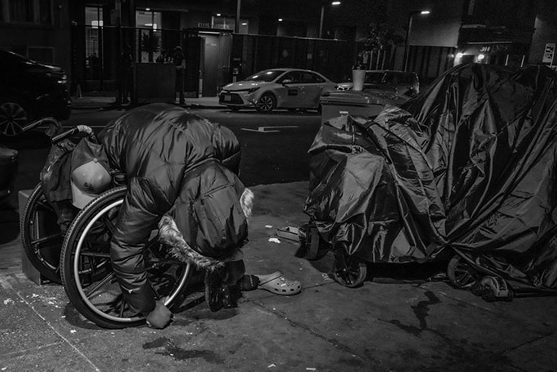 A man slumped over in his wheelchair in San Francisco's Tenderloin neighborhood.