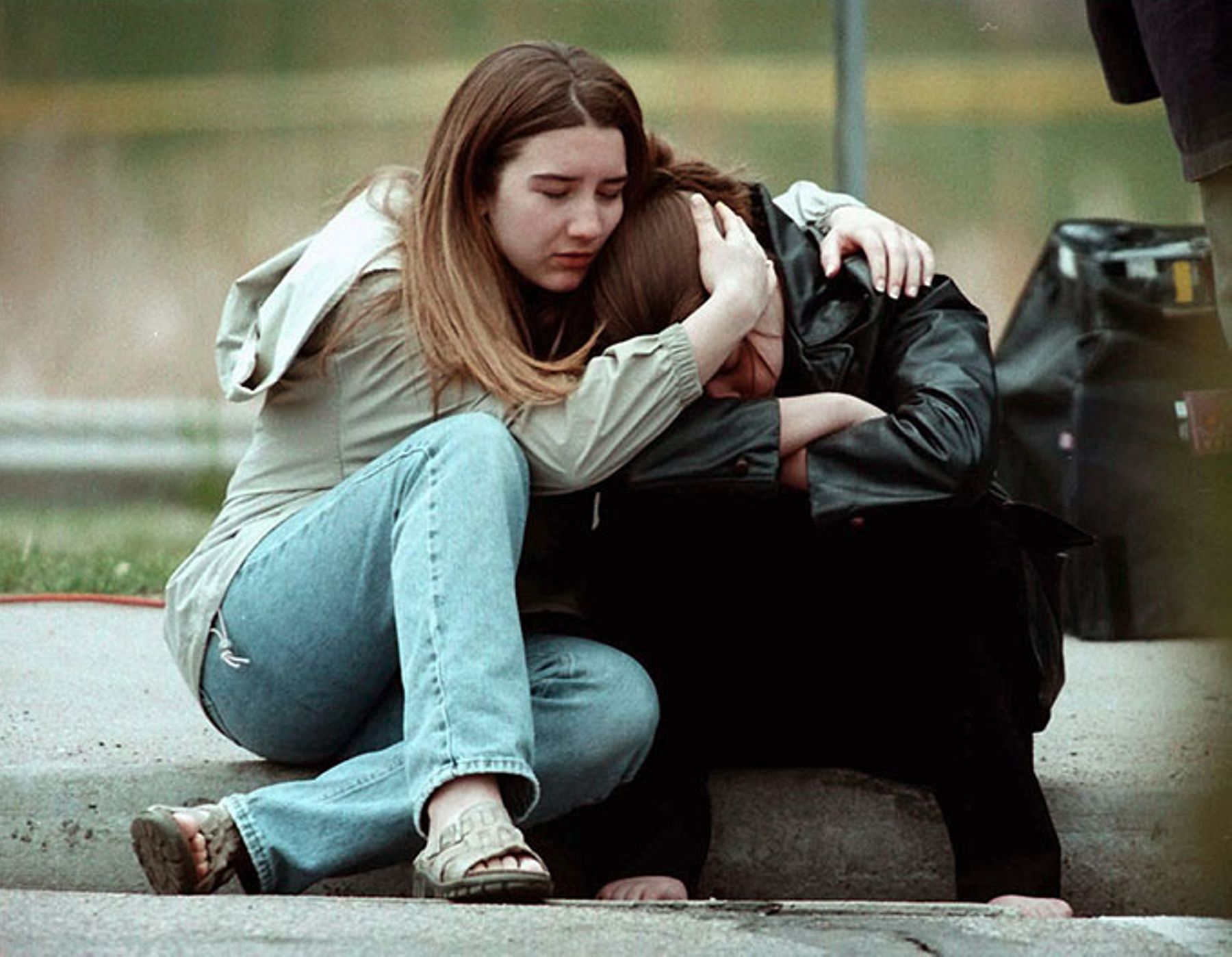 Columbine High School students Katie Trojan and Lauren Beachem grieve after school shooting, Littleton, Colorado.