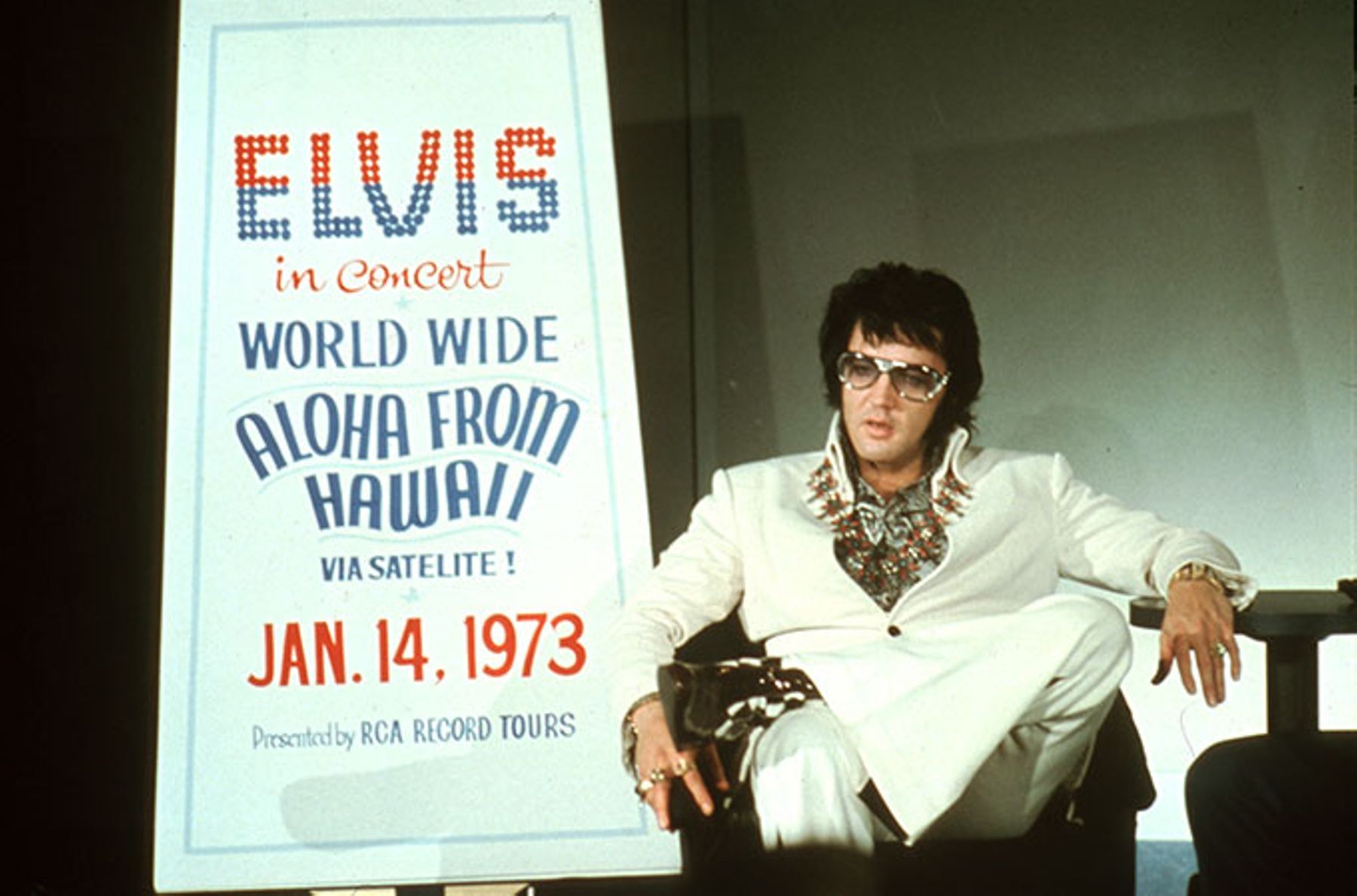 Elvis Presley holds a press conference at the Las Vegas Hilton Hotel to announce his upcoming concert Aloha from Hawaii.