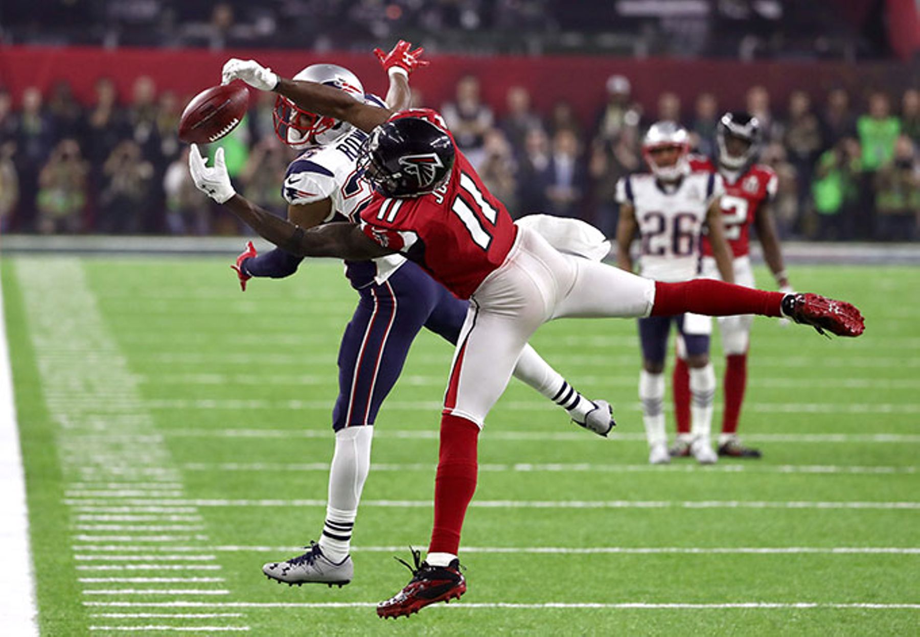 Julio Jones of the Atlanta Falcons makes a catch over Eric Rowe of the New England Patriots during Super Bowl LI in 2017.