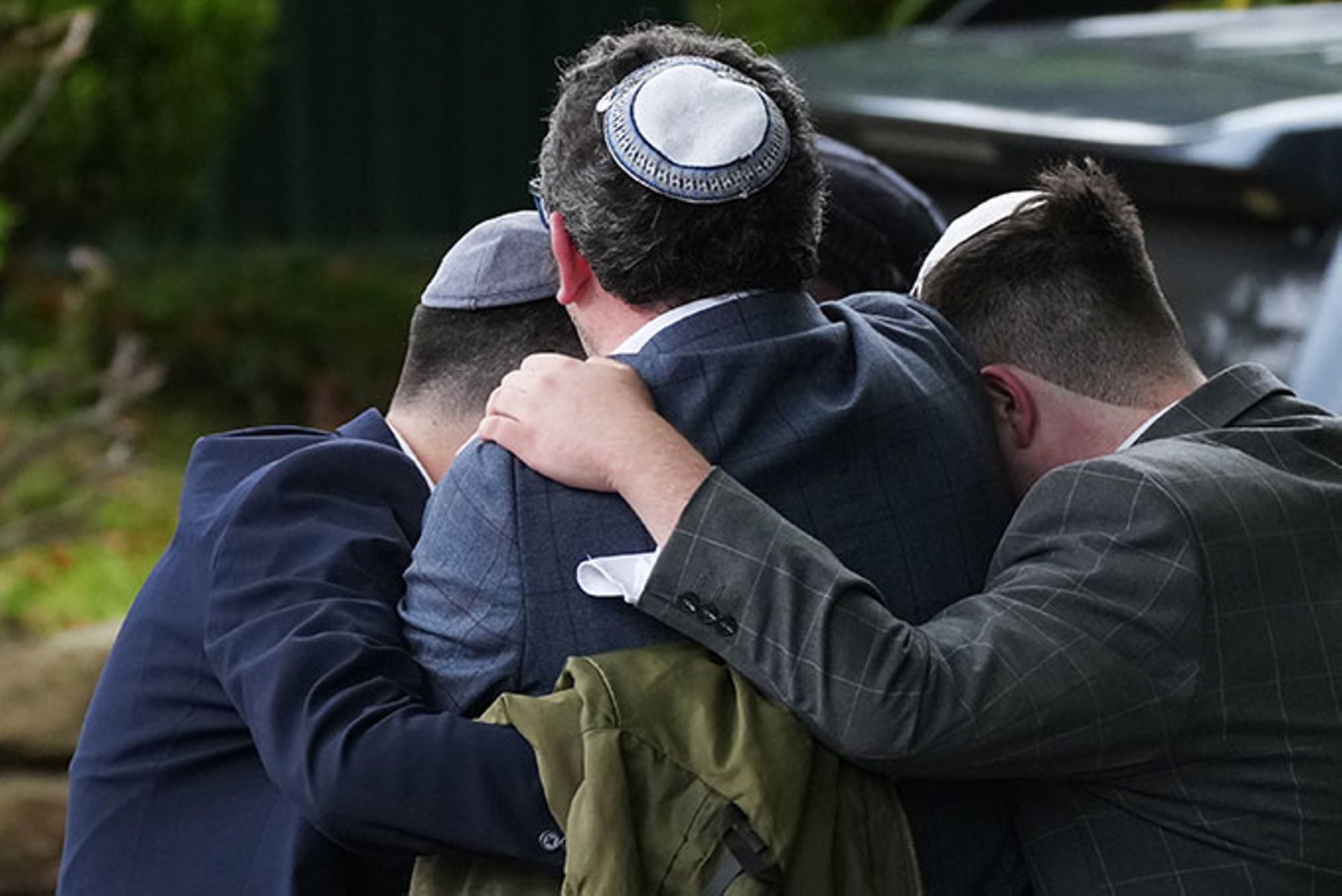 Members of the public react after the synagogue attack in Manchester, England.