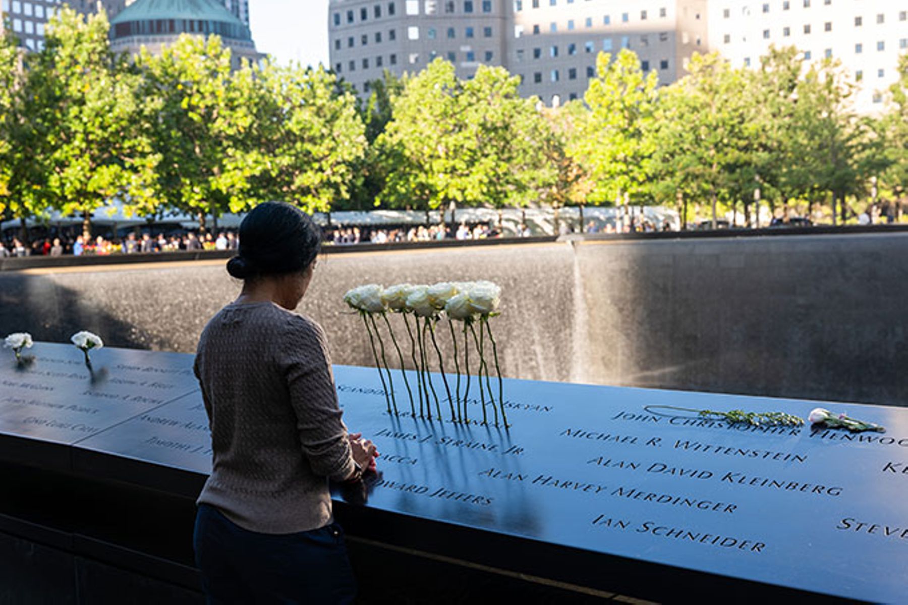 People attend a memorial service at the National September 11 Memorial & Museum in lower Manhattan.