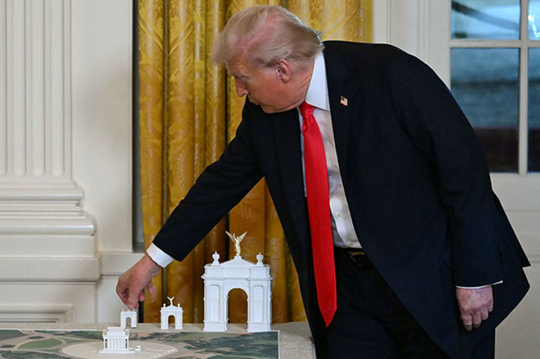 President Trump with a 3-D model of the Independence Arch.