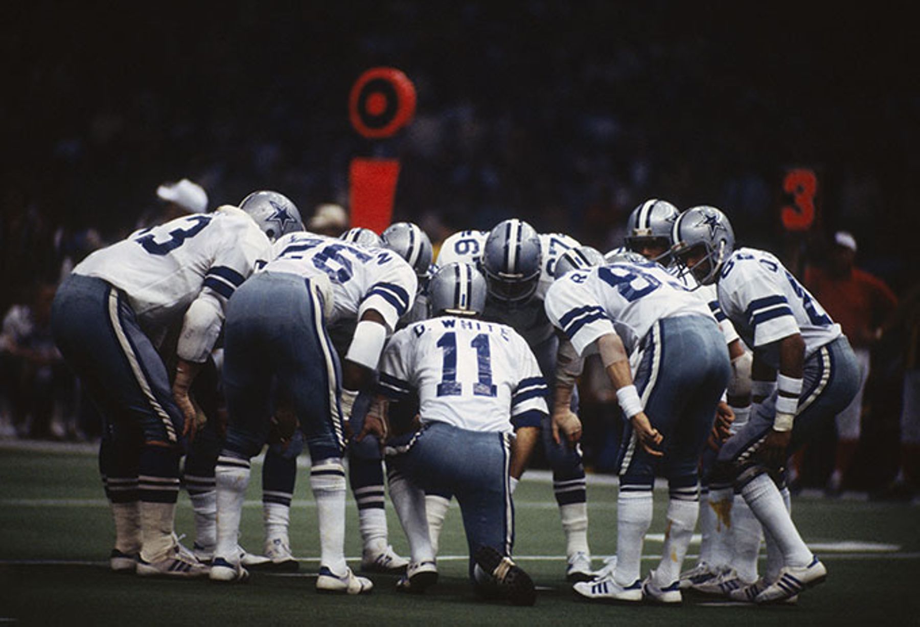 Quarterback Danny White huddles with his Dallas Cowboys teammates during Super Bowl XII against the Denver Broncos in 1978.