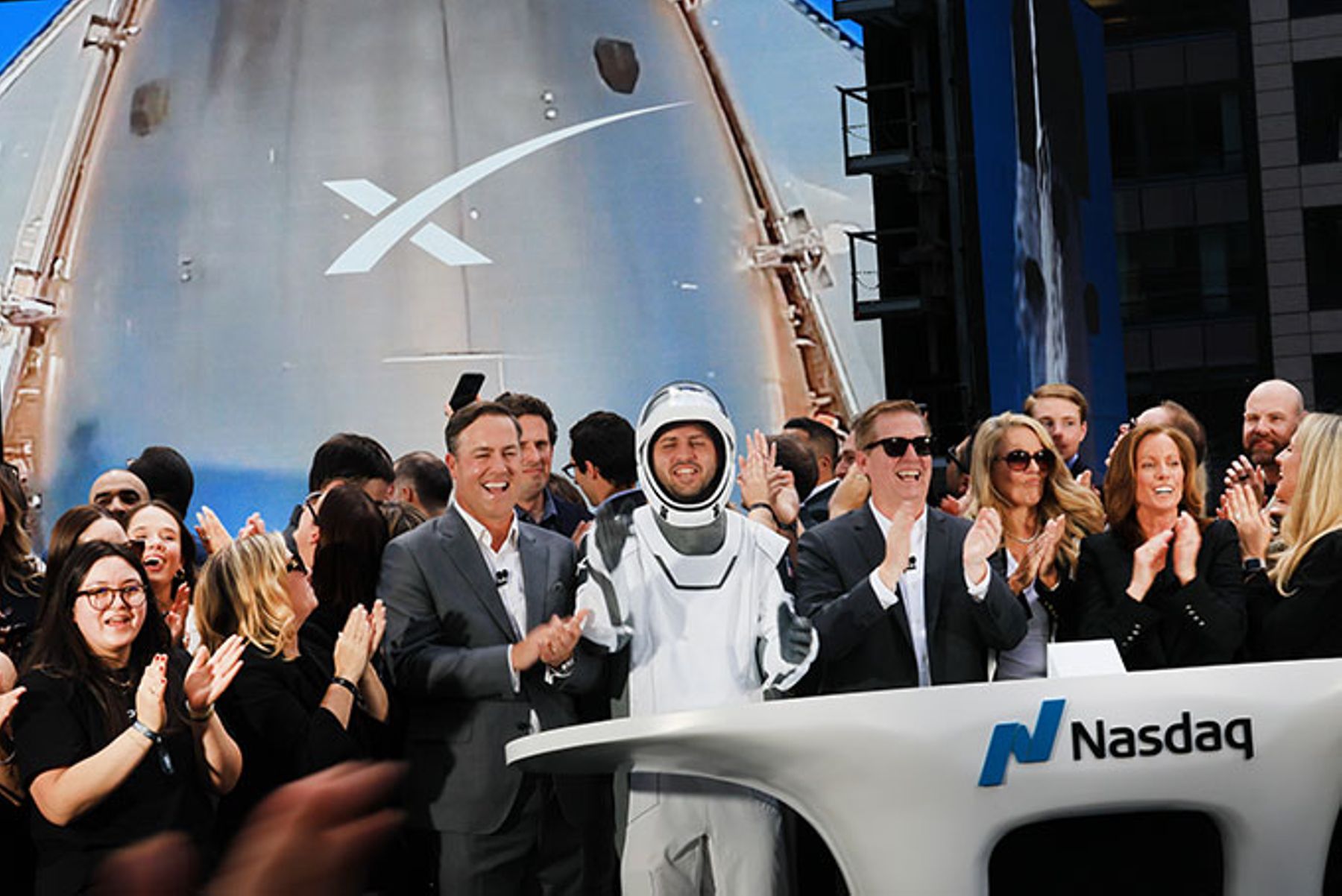 SpaceX employees celebrate the market close of the SpaceX initial public offering (IPO).