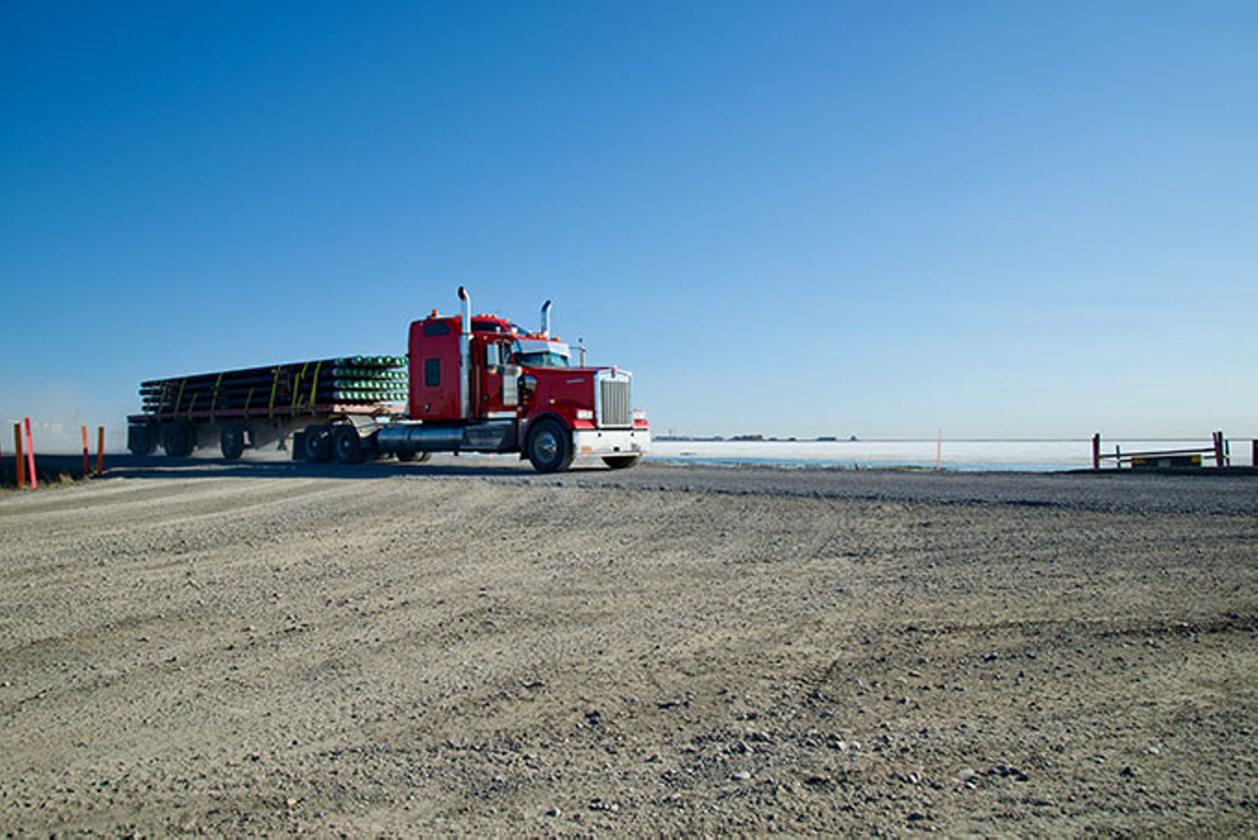 A Specialized Transport & Rigging, LLC truck hauling pipes to the Prudhoe Bay oil field.