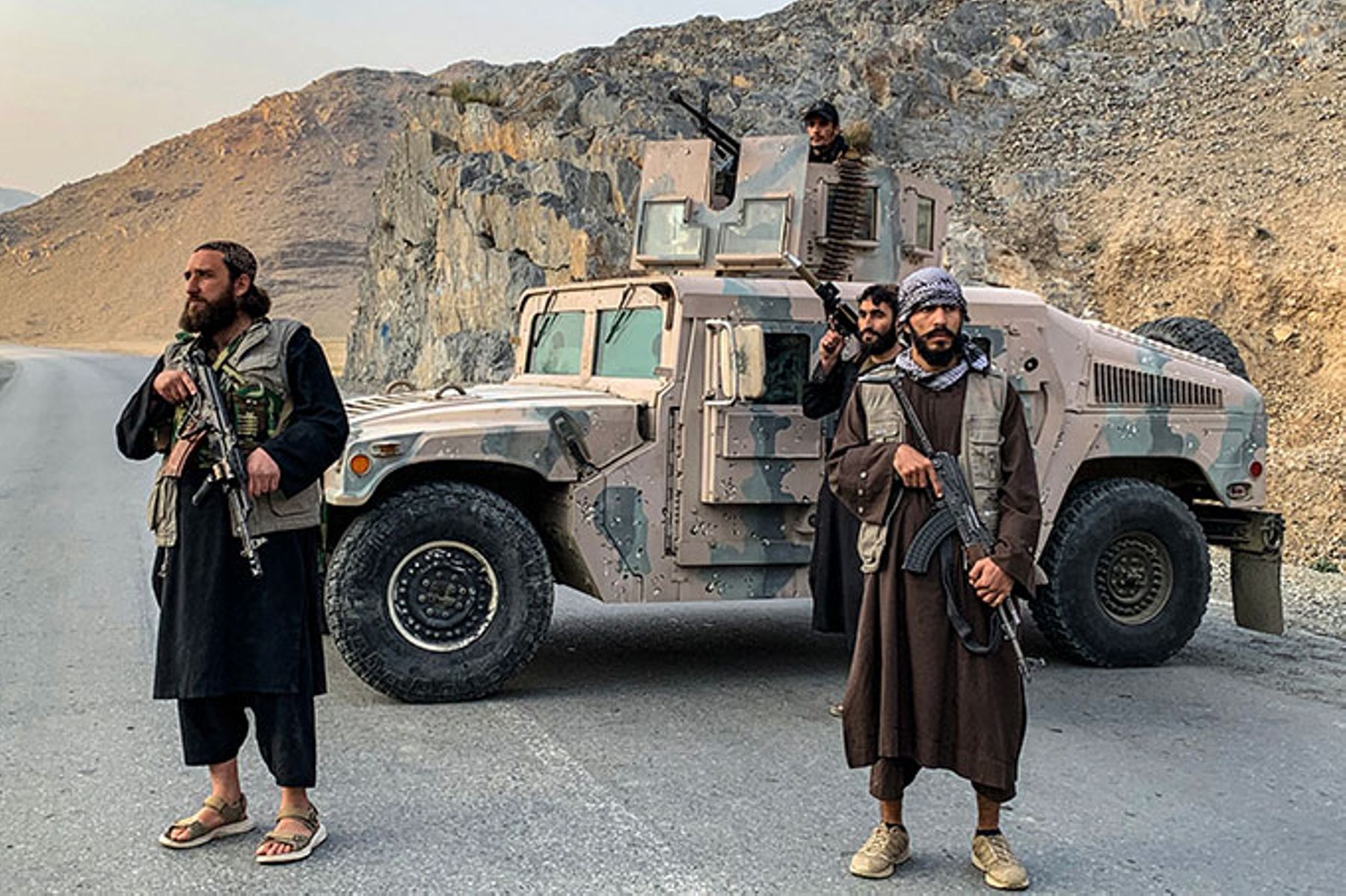Taliban security personnel stand guard near the Torkham border crossing between Afghanistan and Pakistan.