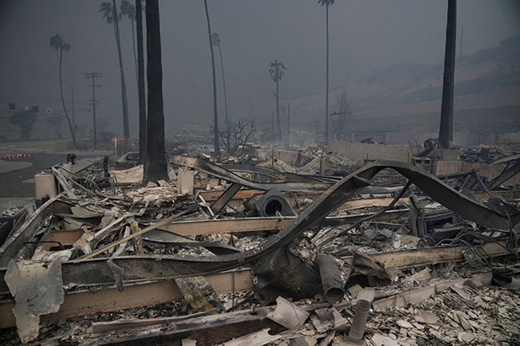The Palisades Fire ravages a neighborhood amid high winds in the Pacific Palisades neighborhood of Los Angeles, 2025.