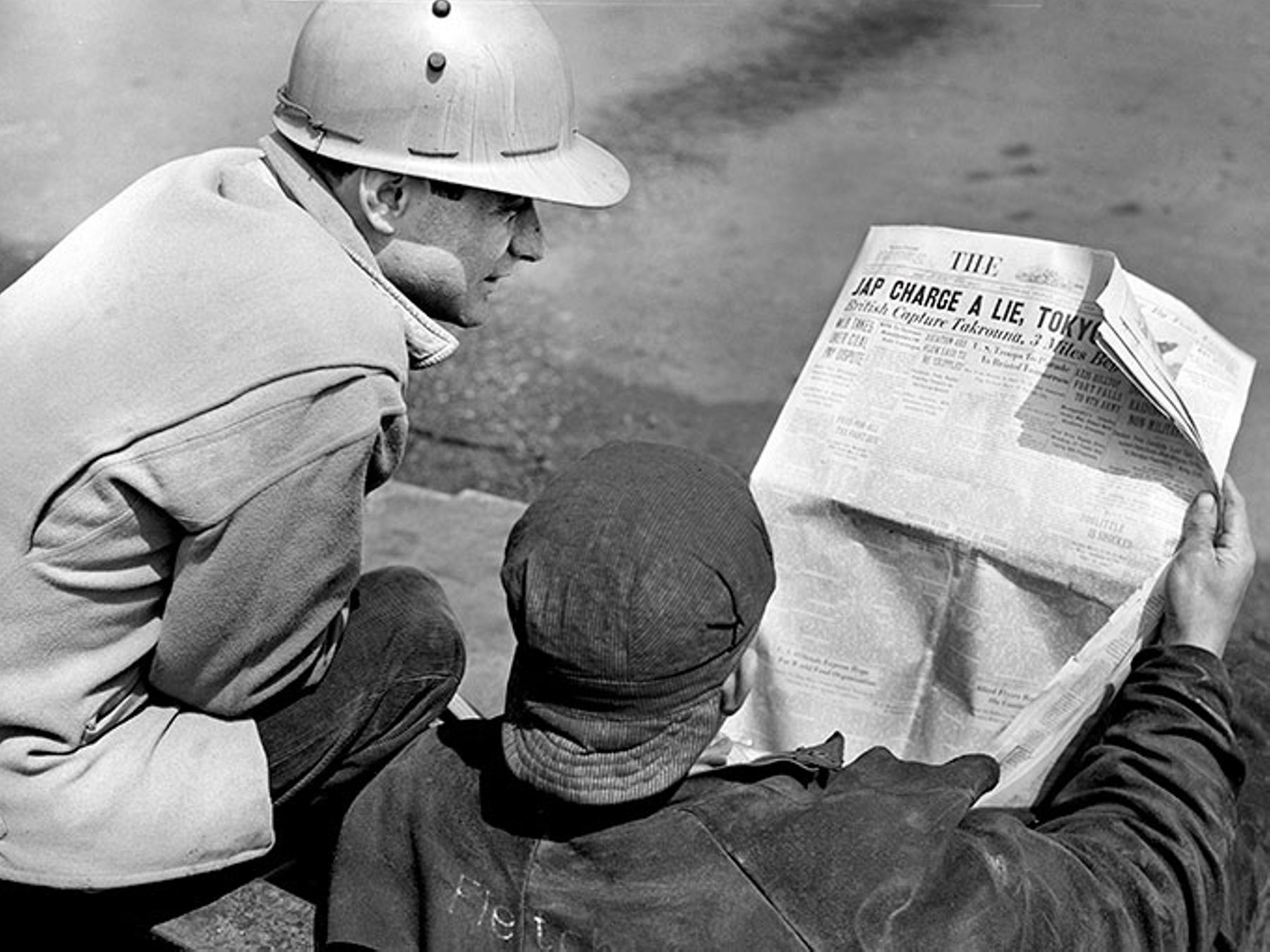 Two factory workers read the Baltimore Sun in 1943.