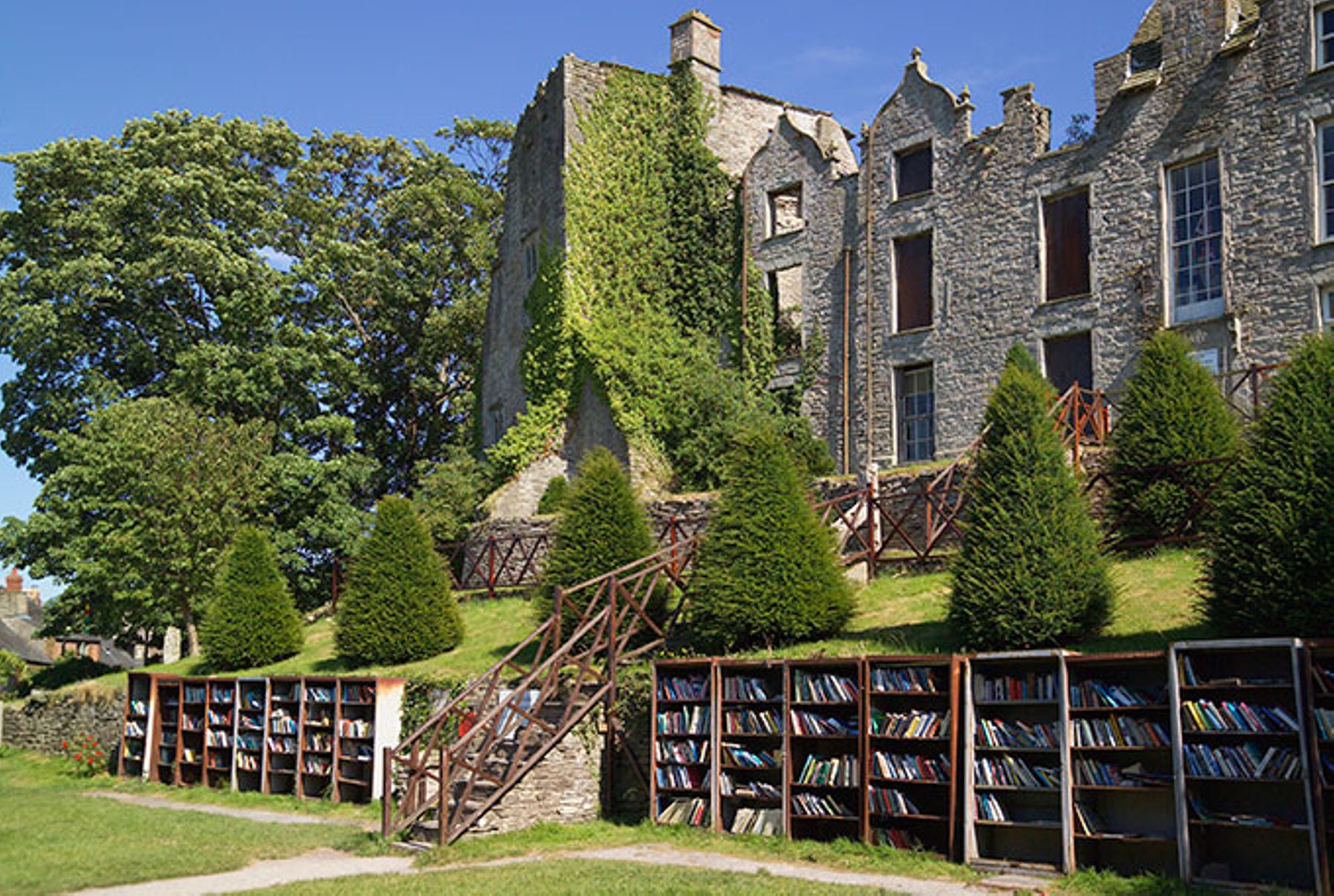 Hay Castle, Hay-on-Wye, Wales, with bookstalls on grounds.