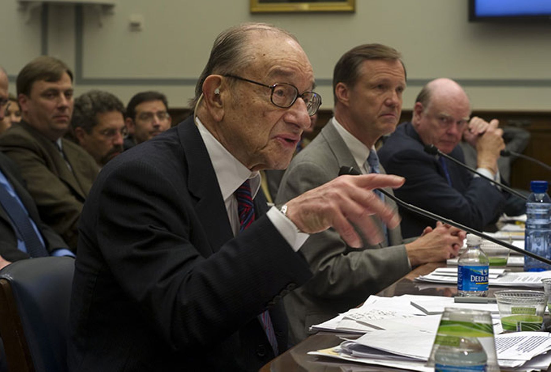 Former Federal Reserve Chairman Alan Greenspan, SEC Chairman Christopher Cox, and former Treasury Secretary John Snow testify during the House Oversight and Government Reform hearing on the financial crisis in the U.S.
